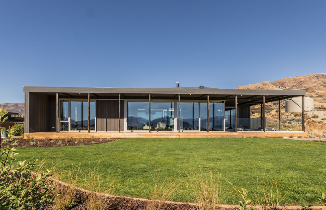Exterior view of modern Wanaka home with floor to ceiling windows